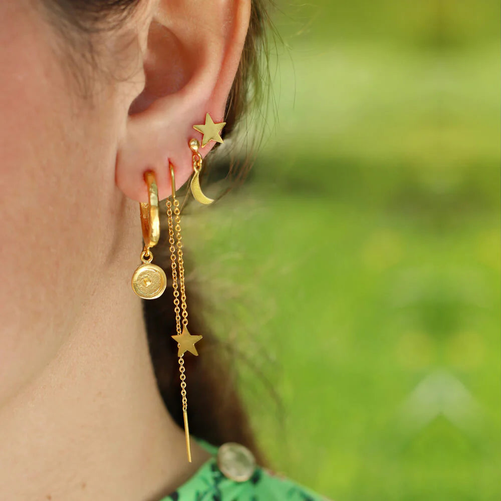 Curated Ear: How to wear stacked earrings.
